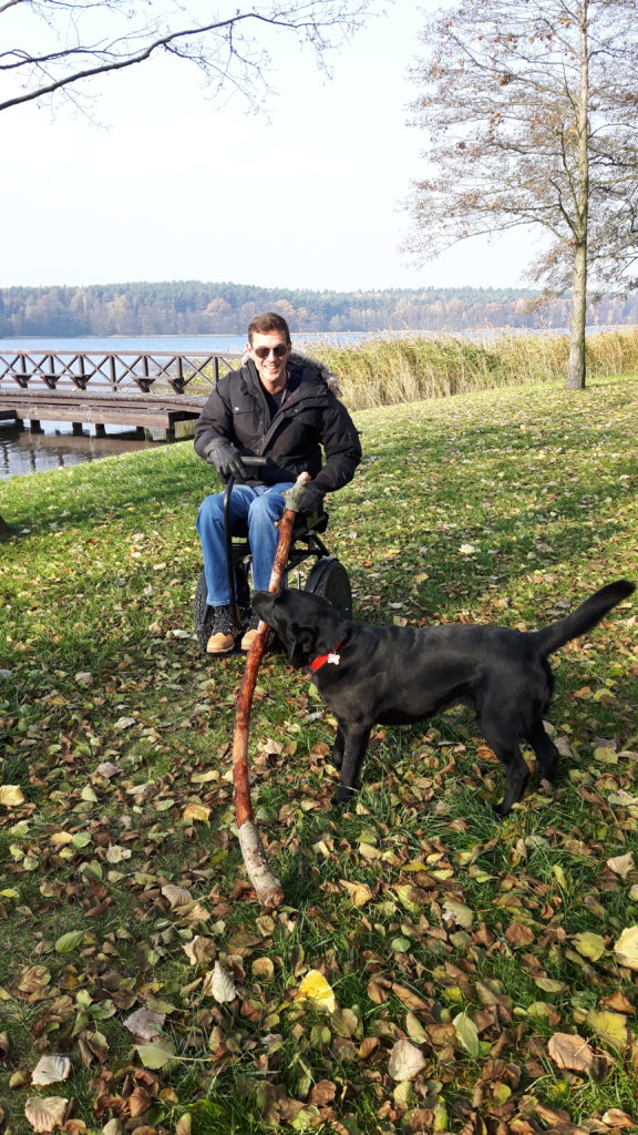 Blumil electric wheelchair and Coco by the lake