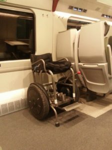 Blumil i2 electric wheelchair on a train