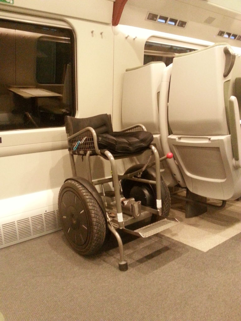 Blumil electric wheelchair in a train, public transport, accessible travel